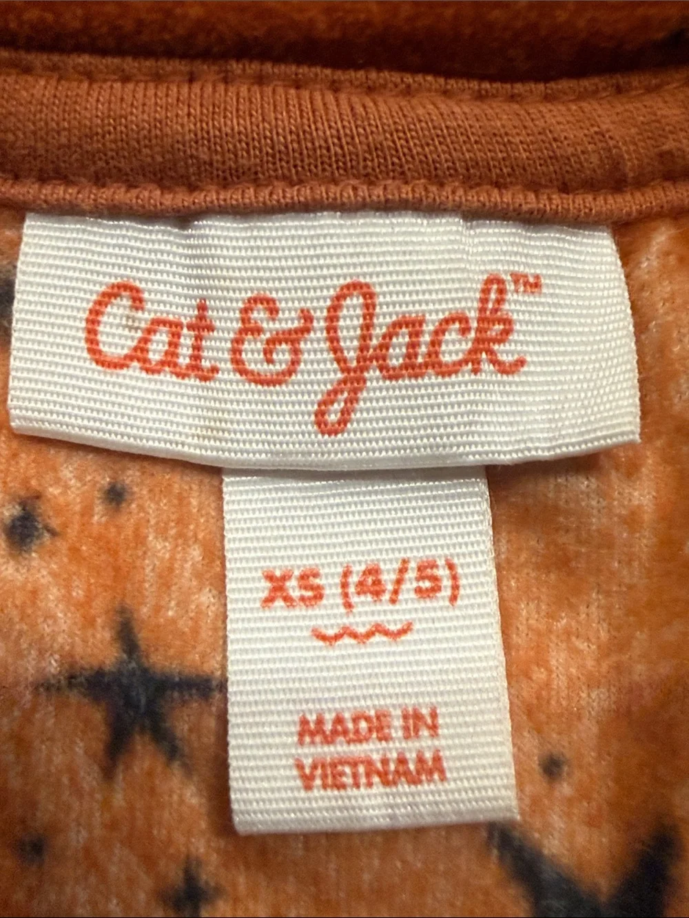 Cat & Jack rust orange velour set with black star pattern size xsmall.